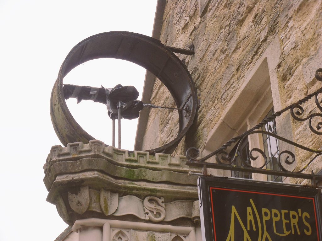 Photo of just the clock casing at Napper's Mite, the mechanism and clock face having been removed for restoration