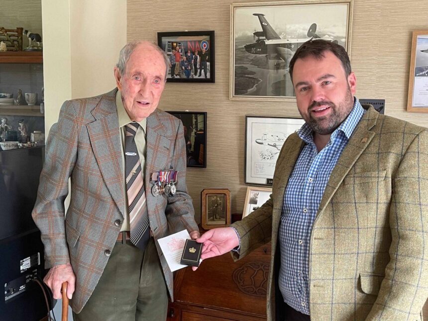 Ken Symonds being presented with the Bomber Command Clasp by Chris Loder MP