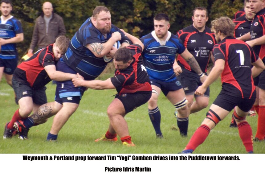 Weymouth & Portland prop forward Tim 'Yogi' Comben drives into the Puddletown forwards