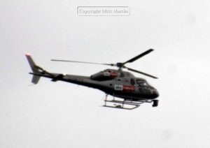 A Sky News chopper circles overhead