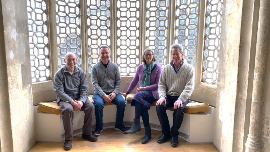 Photo is of the four organisers: Mark Chivers and Neil Smith of Zero Carbon Dorset, Jenni Morisetti of Sustainable Dorset and Giles Watts of Dorset Climate Action Network at Dorchester’s Corn Exchange at a pre-meeting on March 16th
