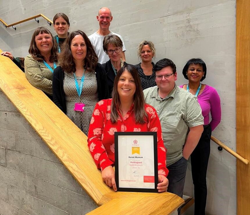 Claire Dixon, Executive Director and team of Dorset Museum & Art Gallery with the VisitEngland Gold Visitor Attraction Accolade  - © Dorset Museum 2021