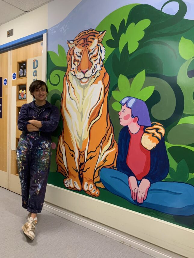 Marina with her Mural on Kingfisher Ward