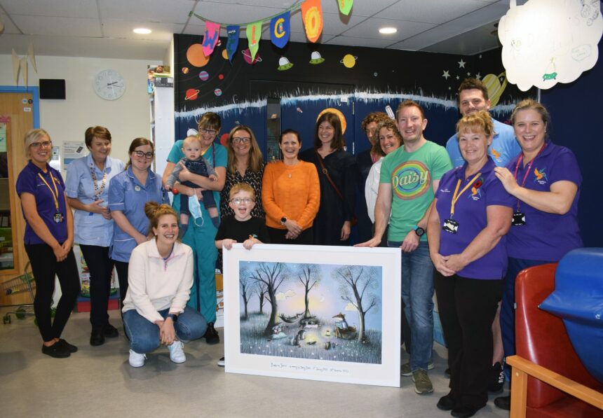 Katie (centre, with orange top) with Lorna to the right (in black) and Clare Hollingsworth to the left and members of the Kingfisher team