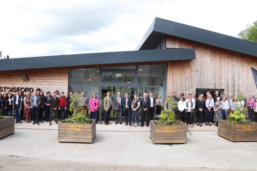 Guests, staff and students outside new University Centre at Kingston Maurward