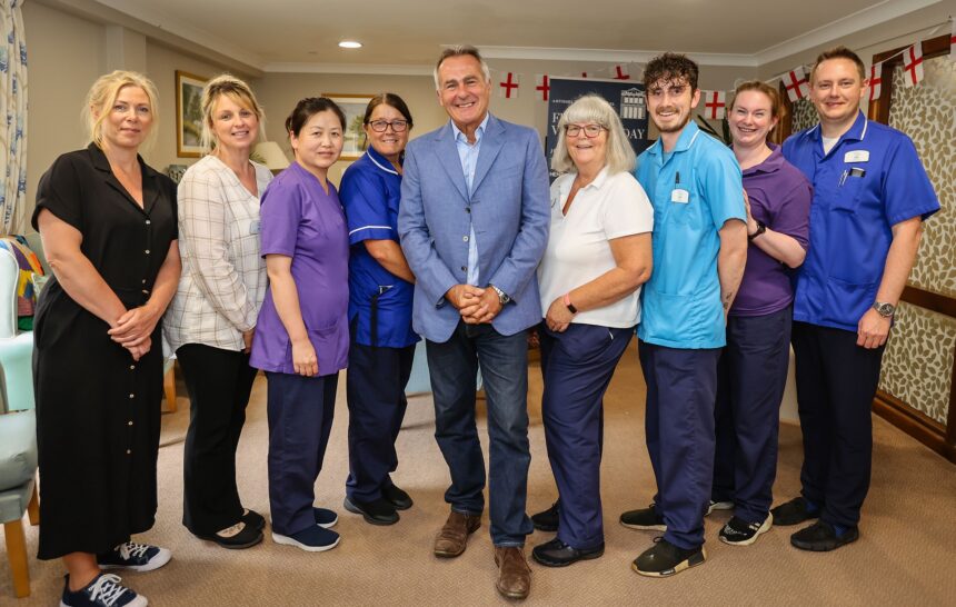 Antiques expert, Paul Martin, pictured with the Maiden Castle House care home team