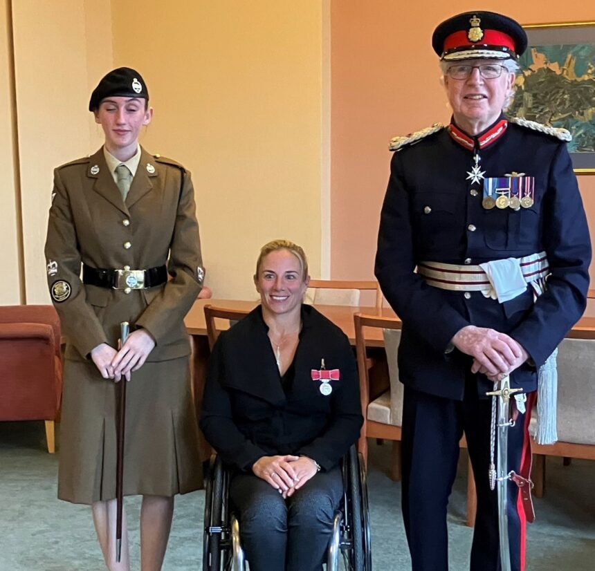 HM Lord-Lieutenant of Dorset, Angus Campbell CVO, with Paralympian Flag Bearer and tennis player, Lucy Shuker at her BEM presentation ceremony in the Members’ Lounge at County Hall.