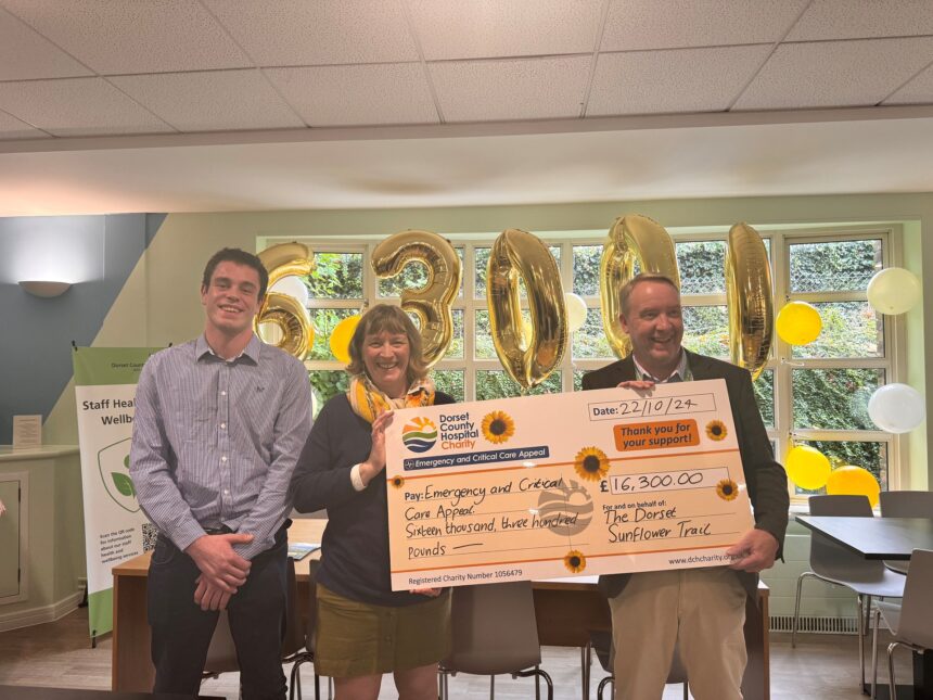 Hazel Hoskin (centre) with son Thomas Hoskin (left) and Simon Pearson, Head of Charity (right) at Sunflowers presentation event