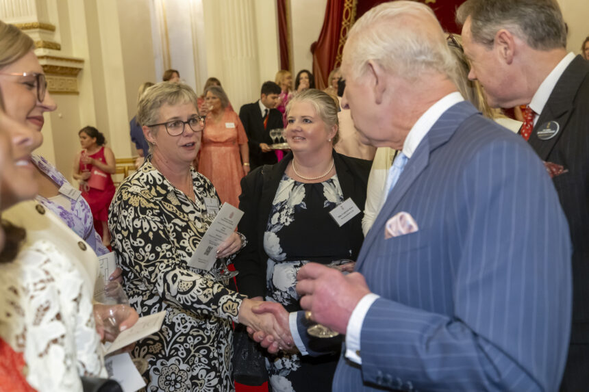 Director of Clinical Services, Caroline Sweetland, shaking hands with King Charles III