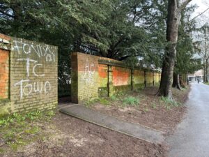 Graffiti on a Victorian Wall in Bowling Alley Walk
