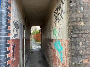 Graffti on a passage off Trinity Street