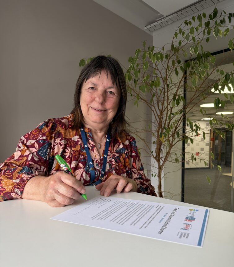 Cllr Gill Taylor, fraud and scams victim charter signing.