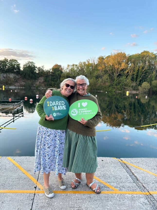 Two DARE to BARE participants after completing the swim